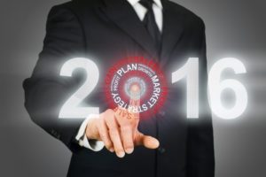 Businessman clicking 2016 business target